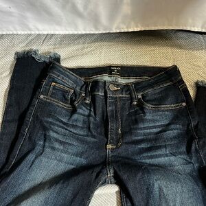 skinny jeans with tattered bottom dark wash